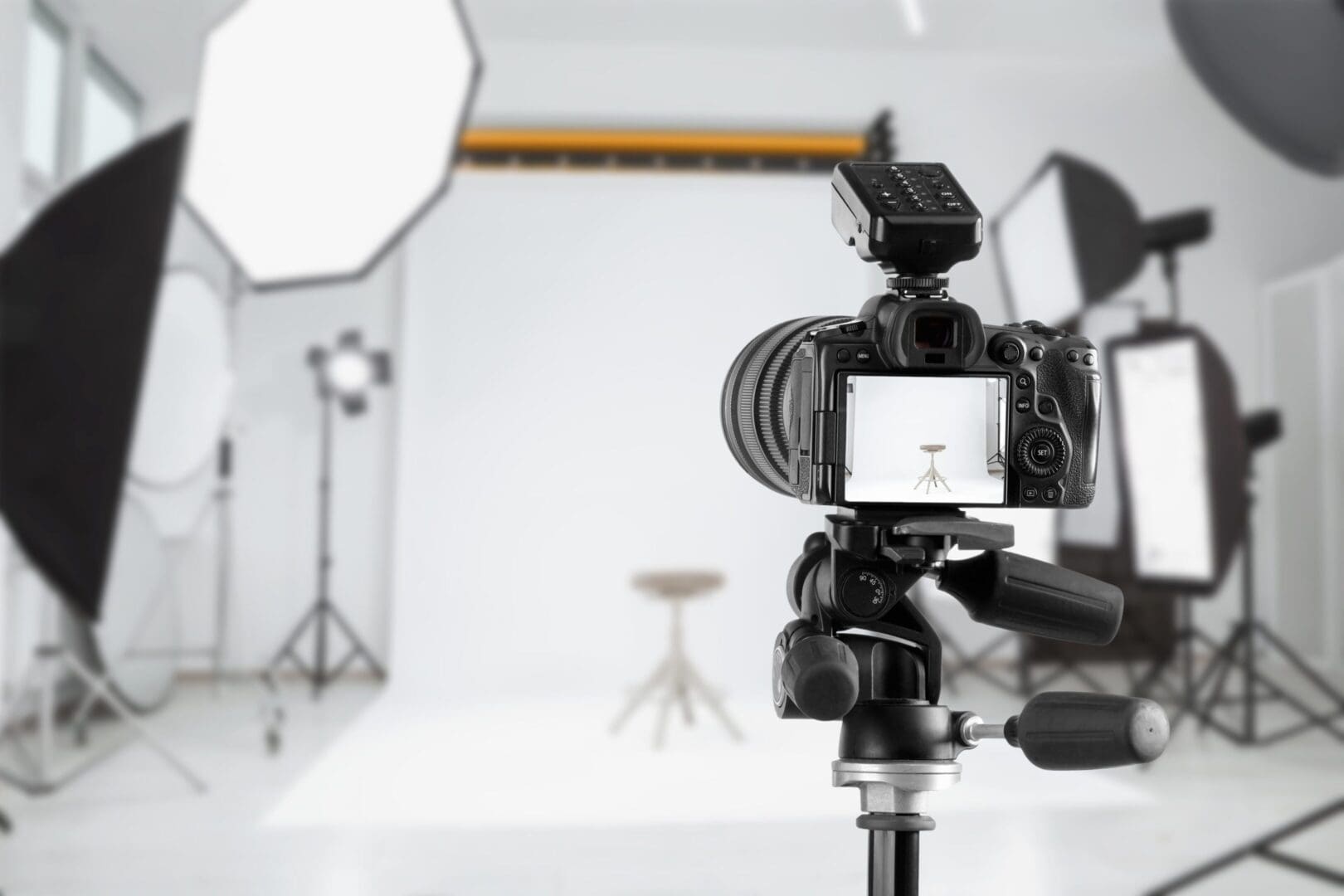 Professional photography studio setup with camera and lighting equipment.
